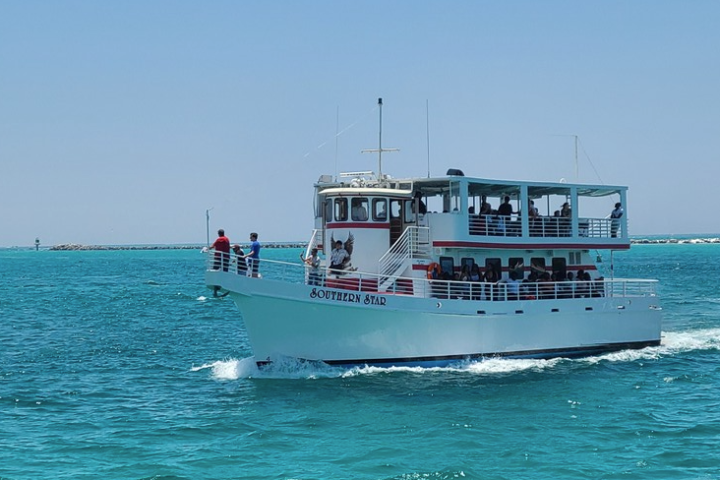 the southern star boat sailing the emerald coast taking people on a dolphin cruise