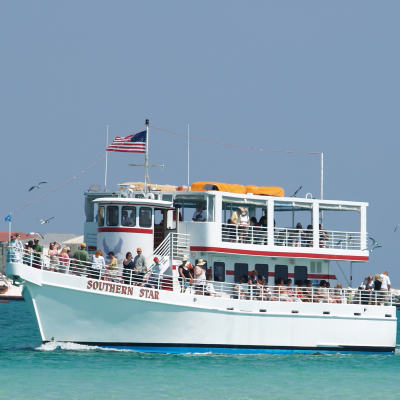 the Southern Star glass bottom boat bringing people on a Destin dolphin cruise