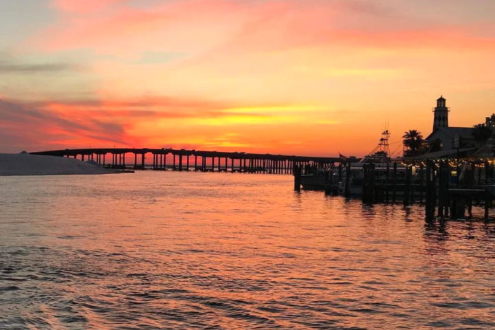 a beautiful pink sky on a destin sunset cruise